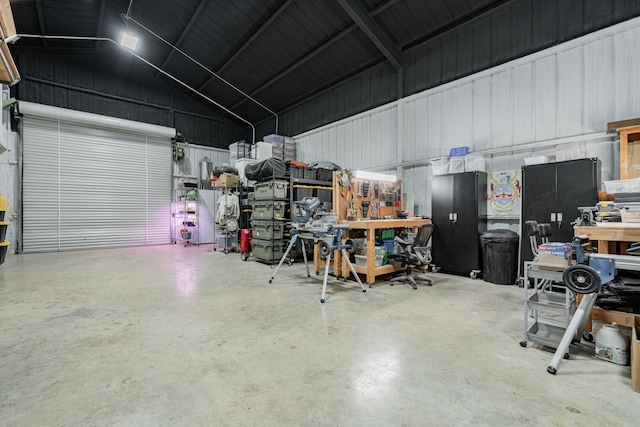 garage featuring metal wall and a workshop area