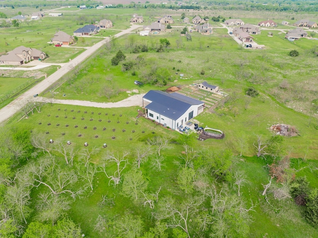 birds eye view of property featuring a rural view