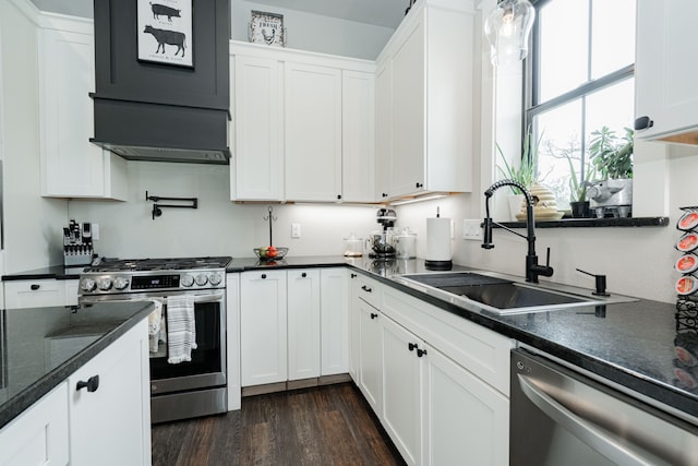 kitchen featuring white cabinetry, a sink, and appliances with stainless steel finishes