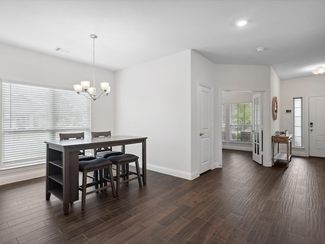 dining space featuring dark wood-style flooring, baseboards, visible vents, an inviting chandelier, and recessed lighting