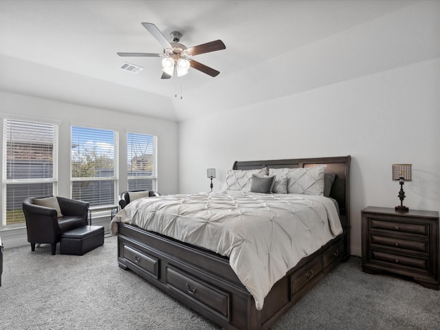 carpeted bedroom with visible vents and ceiling fan