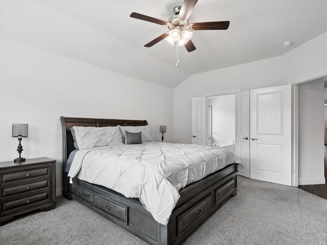 carpeted bedroom with lofted ceiling and ceiling fan