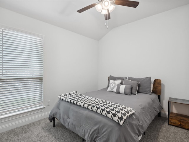 bedroom featuring lofted ceiling, baseboards, carpet, and ceiling fan