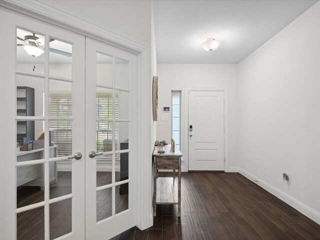 foyer entrance featuring ceiling fan, baseboards, french doors, and wood finished floors