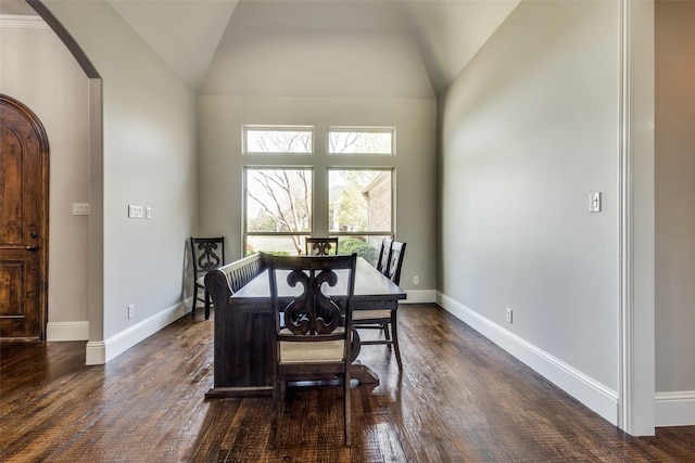 1891 Fostermill Dr, Prosper, TX 75078 - dining room with arched walkways, dark wood-style floors, baseboards, and vaulted ceiling