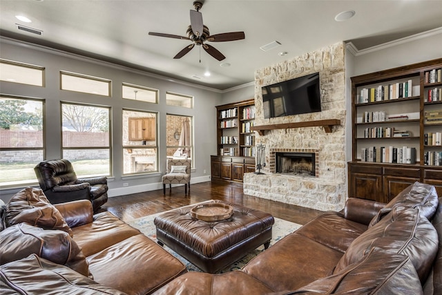 1891 Fostermill Dr, Prosper, TX 75078 - living area featuring wood finished floors, ceiling fan, crown molding, a stone fireplace, and baseboards