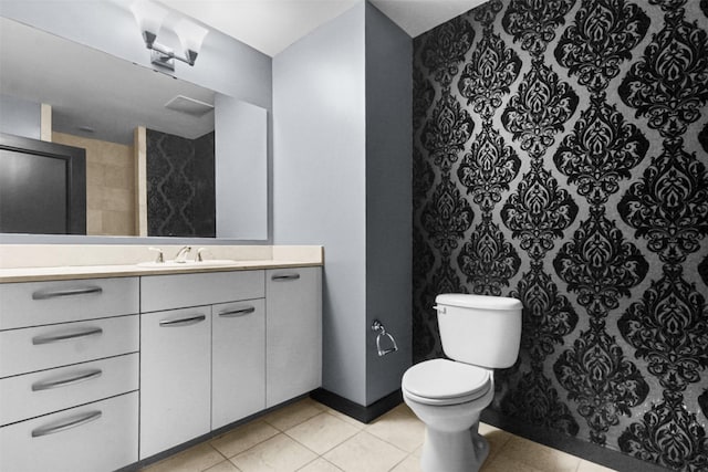 1200 Main St Unit 1511, Dallas, TX 75202 - full bathroom with vanity, toilet, and tile patterned flooring