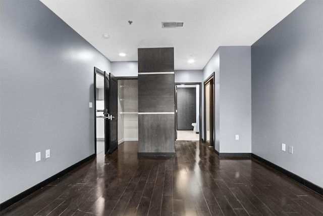 1200 Main St Unit 1511, Dallas, TX 75202 - unfurnished room featuring visible vents, dark wood-style flooring, and baseboards