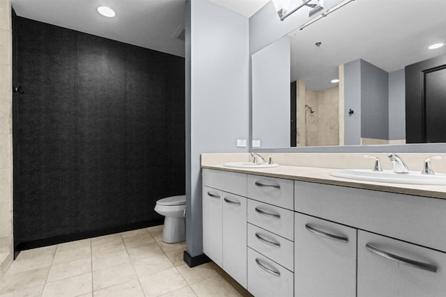1200 Main St Unit 1511, Dallas, TX 75202 - full bath with double vanity, toilet, a tile shower, and a sink