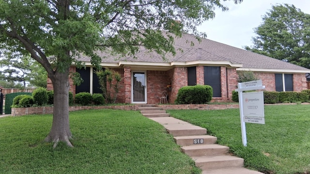 518 Allen Dr, Euless, TX 76039 - single story home featuring roof with shingles, brick siding, and a front yard
