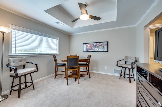 4816 Cape Coral Dr, Dallas, TX 75287 - dining space featuring a tray ceiling, light colored carpet, visible vents, and ornamental molding