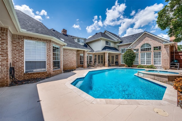 4816 Cape Coral Dr, Dallas, TX 75287 - view of swimming pool featuring a pool with connected hot tub and a patio area