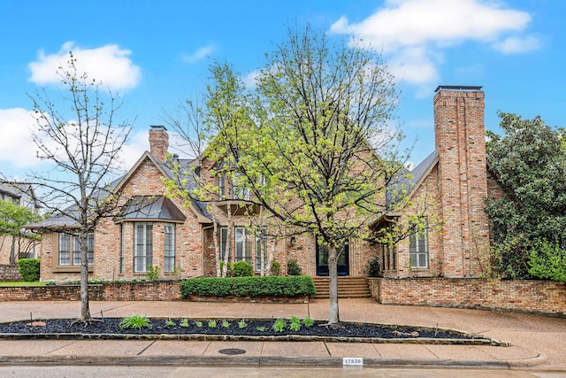 17828 Cedar Creek Canyon Dr, Dallas, TX 75252 - english style home featuring a chimney and brick siding