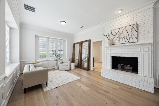 17828 Cedar Creek Canyon Dr, Dallas, TX 75252 - living room featuring visible vents, crown molding, wood finished floors, and a decorative wall
