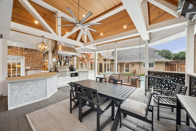 17828 Cedar Creek Canyon Dr, Dallas, TX 75252 - wooden deck featuring grilling area, outdoor dining space, a gazebo, ceiling fan, and an outdoor kitchen