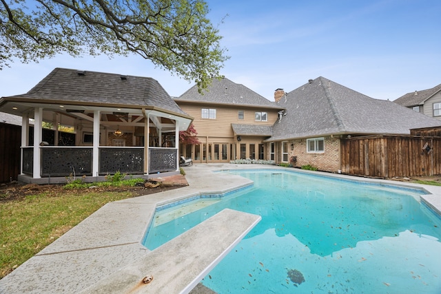17828 Cedar Creek Canyon Dr, Dallas, TX 75252 - view of pool with a sunroom, fence, a patio, a diving board, and a fenced in pool