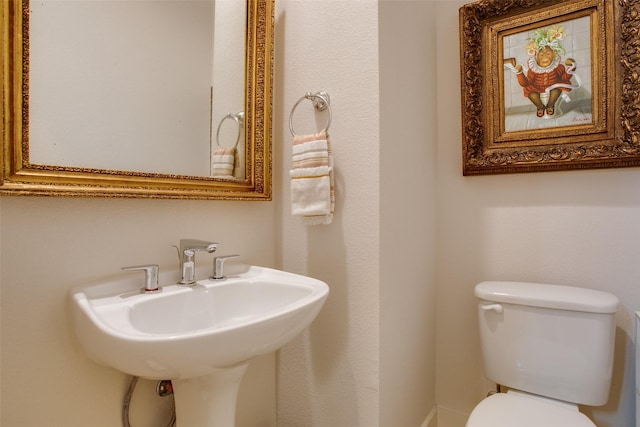 bathroom with a sink and toilet