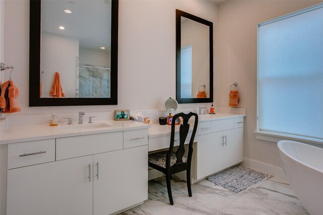 bathroom featuring vanity, recessed lighting, marble finish floor, a stall shower, and a freestanding bath