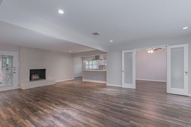 3336 Whitehall Dr, Dallas, TX 75229 - unfurnished living room with dark wood-style floors, a fireplace, baseboards, recessed lighting, and ceiling fan