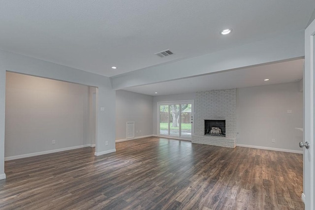3336 Whitehall Dr, Dallas, TX 75229 - unfurnished living room featuring dark wood finished floors, baseboards, a fireplace, and recessed lighting
