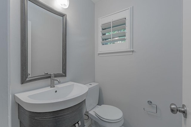 3336 Whitehall Dr, Dallas, TX 75229 - half bathroom with toilet and vanity