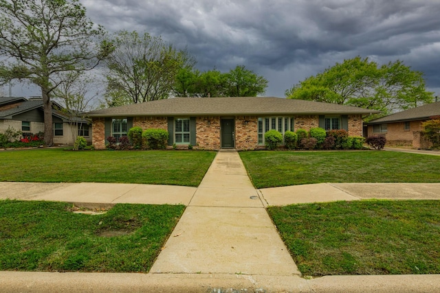 3336 Whitehall Dr, Dallas, TX 75229 - ranch-style home with a front lawn and brick siding