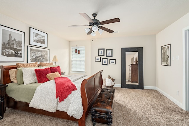 bedroom with baseboards, visible vents, ceiling fan, and carpet