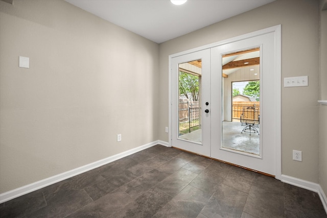 doorway to outside featuring baseboards and french doors