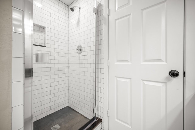 bathroom with a shower stall