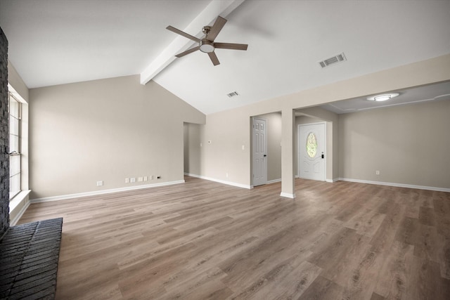 unfurnished living room with vaulted ceiling with beams, baseboards, visible vents, light wood-style floors, and ceiling fan
