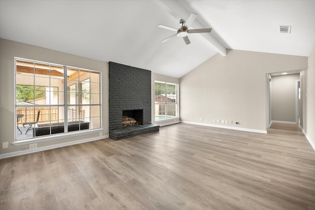 unfurnished living room featuring ceiling fan, wood finished floors, visible vents, and vaulted ceiling with beams