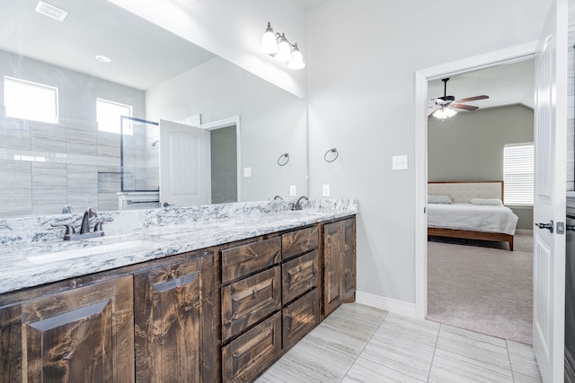 full bathroom with visible vents, double vanity, ceiling fan, a sink, and ensuite bath