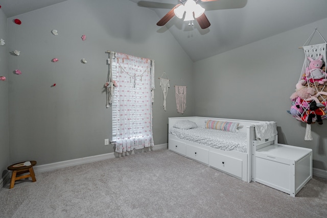 unfurnished bedroom with baseboards, lofted ceiling, carpet flooring, and a ceiling fan