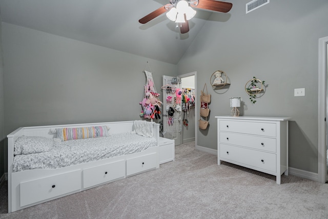 bedroom with visible vents, carpet, baseboards, vaulted ceiling, and a spacious closet