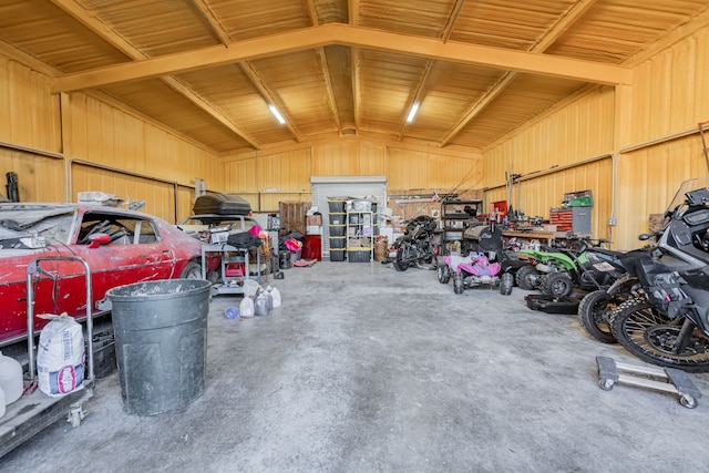 garage featuring metal wall and a workshop area