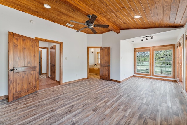 interior space featuring visible vents, baseboards, wood finished floors, lofted ceiling, and wooden ceiling