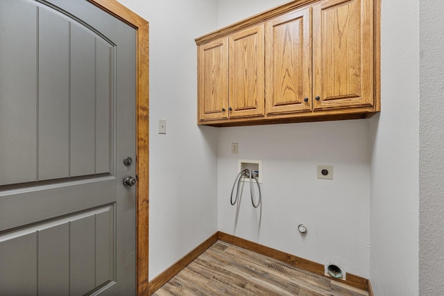 clothes washing area with hookup for a washing machine, electric dryer hookup, baseboards, cabinet space, and gas dryer hookup