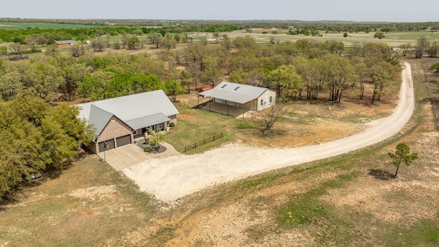 birds eye view of property with a rural view