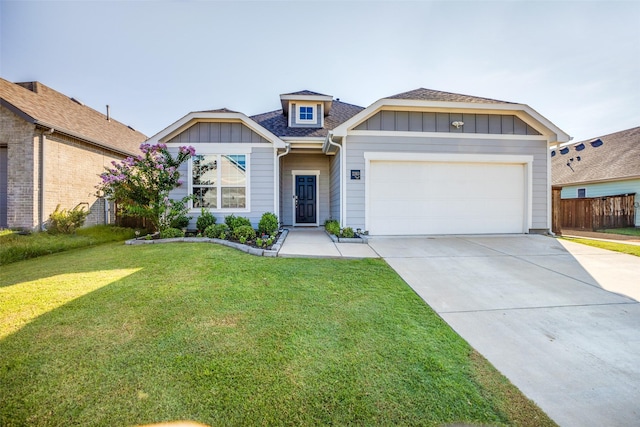 view of front of home featuring concrete driveway, fence, an attached garage, board and batten siding, and a front lawn