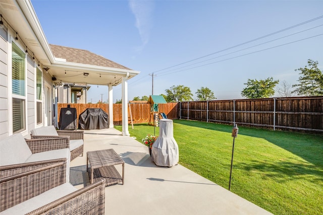 view of patio / terrace with a fenced backyard, outdoor lounge area, and a playground