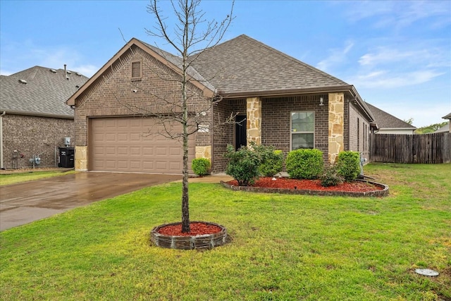 view of front facade featuring a front yard, a garage, concrete driveway, brick siding, and roof with shingles