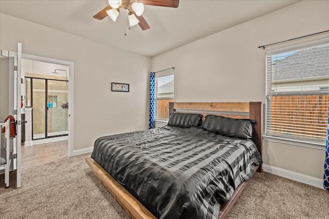 carpeted bedroom with baseboards and a ceiling fan