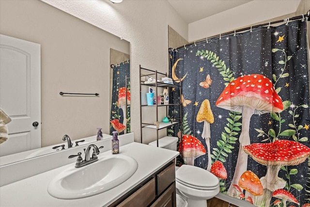bathroom featuring toilet, curtained shower, wood finished floors, and vanity