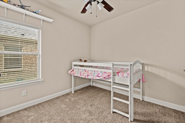 bedroom featuring carpet flooring, baseboards, and a ceiling fan