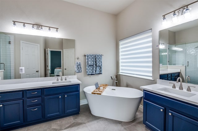 1179 Marquette Dr, Frisco, TX 75033 - ensuite bathroom featuring a shower stall, two vanities, tile patterned floors, and a soaking tub
