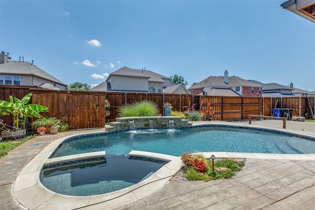 1179 Marquette Dr, Frisco, TX 75033 - view of pool with a pool with connected hot tub and a fenced backyard