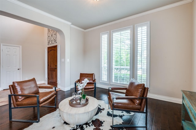 1179 Marquette Dr, Frisco, TX 75033 - living area with baseboards, crown molding, arched walkways, and dark wood-type flooring