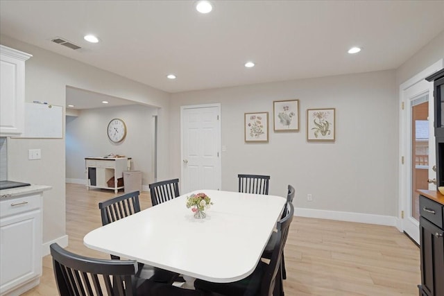 dining area with light wood-style flooring, recessed lighting, baseboards, and visible vents