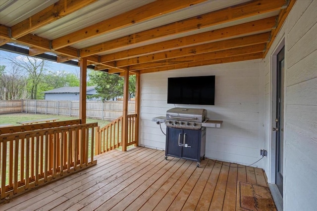 deck featuring a grill and fence
