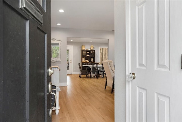 entryway with baseboards, recessed lighting, and light wood-style floors